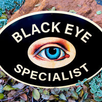 Black Eye Specialist Metal Sign